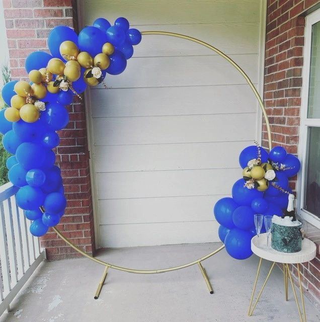 Blue and gold balloon hoop