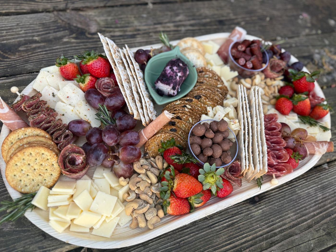 Charcuterie board with cheese, fruit and crackers