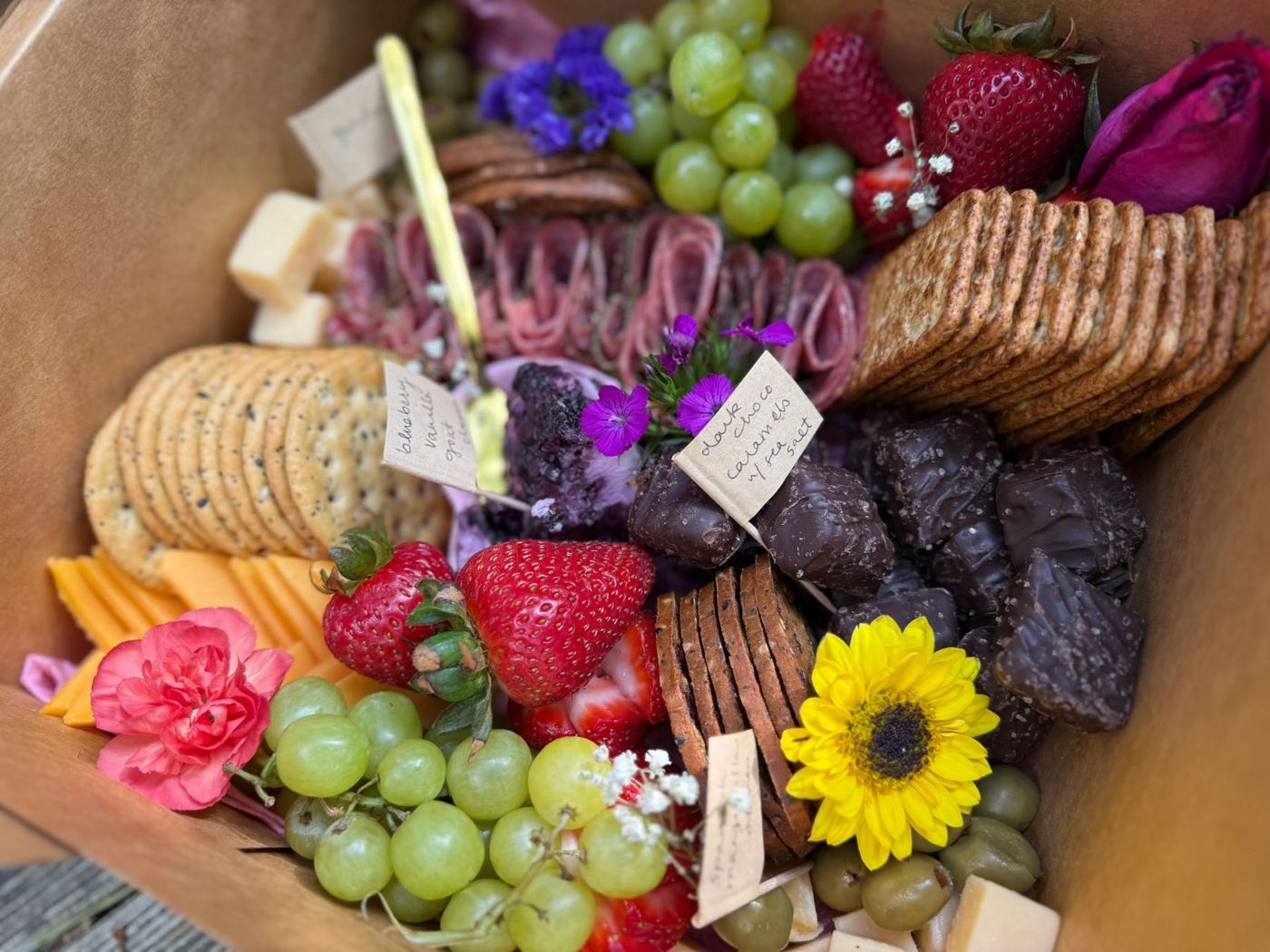 Charcuterie box with a sunflower