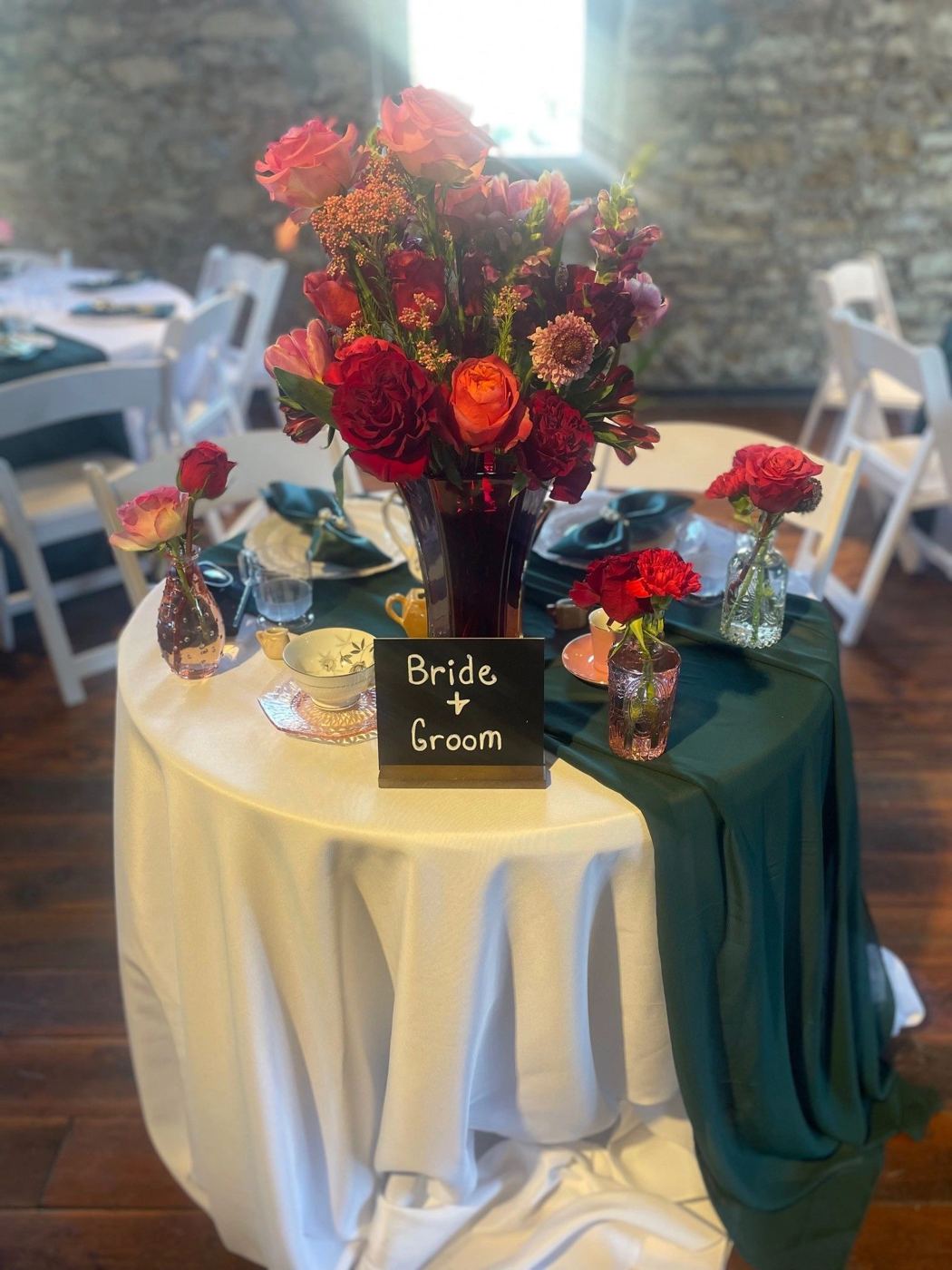 Sweetheart table with a Bride and Groom sign